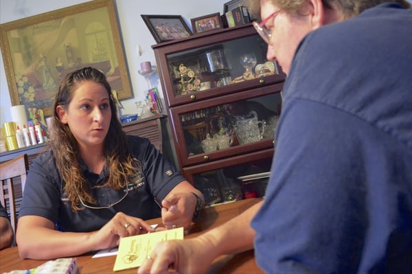 a community paramedic program staff visiting a low-income resident