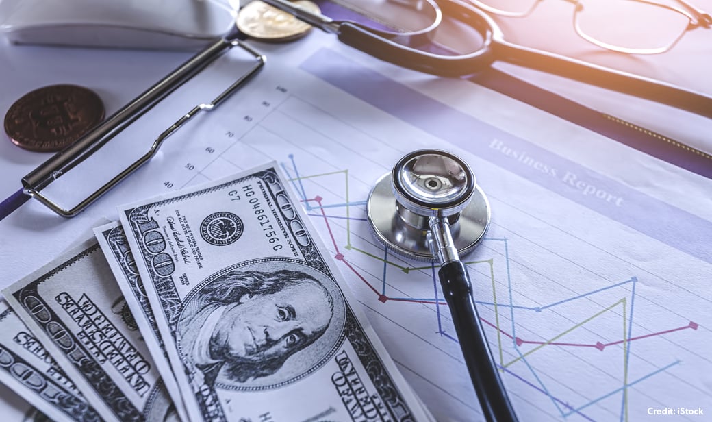 Cash, stethoscope, and healthcare claims
