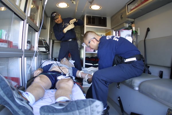 Medics from Tucson Fire Department treating a patient in an ambulance