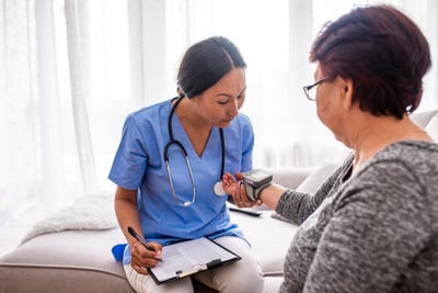 Nurse Treating In Home